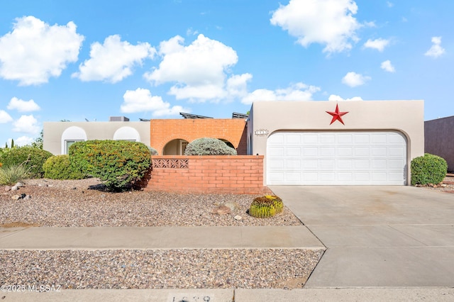 1939 S San Vincent Dr, Green Valley, AZ 85614 - view of front of property featuring stucco siding, concrete driveway, and an attached garage