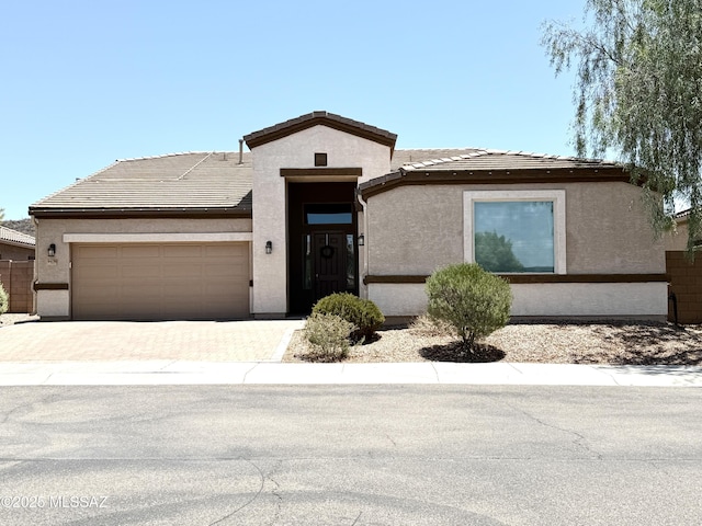 9636 N Havenwood Way, Marana, AZ 85653 - view of front of property with stucco siding, an attached garage, driveway, and a tile roof