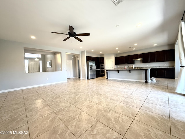 9636 N Havenwood Way, Marana, AZ 85653 - unfurnished living room with ceiling fan, recessed lighting, and light tile patterned flooring