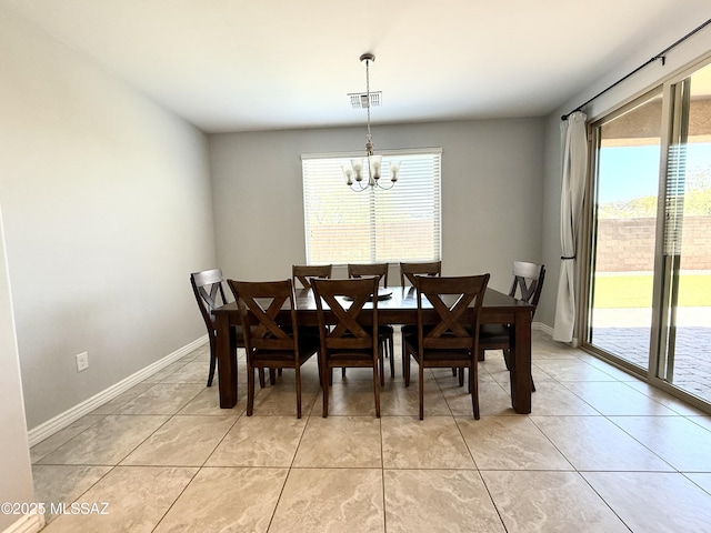 9636 N Havenwood Way, Marana, AZ 85653 - dining space featuring a chandelier and light tile patterned floors