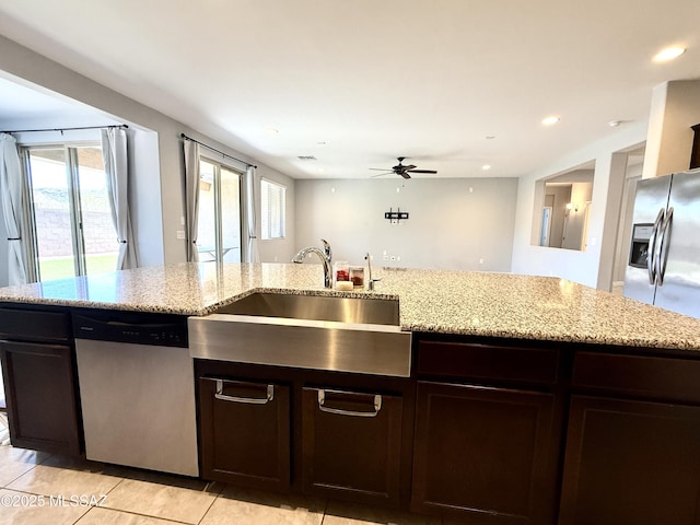9636 N Havenwood Way, Marana, AZ 85653 - kitchen featuring dishwasher, ceiling fan, recessed lighting, light tile patterned floors, and light stone countertops
