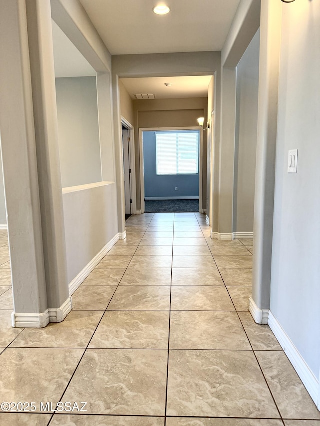9636 N Havenwood Way, Marana, AZ 85653 - corridor featuring light tile patterned floors and baseboards