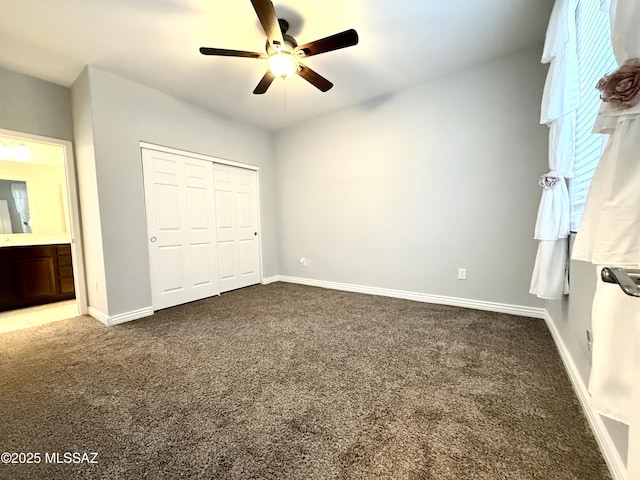 9636 N Havenwood Way, Marana, AZ 85653 - unfurnished bedroom featuring carpet, a closet, and a ceiling fan