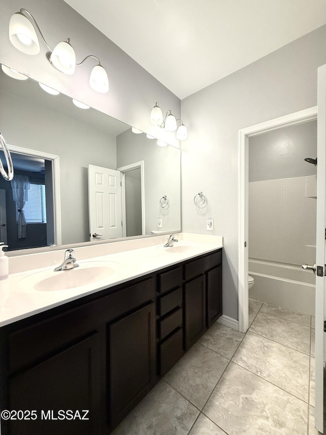 9636 N Havenwood Way, Marana, AZ 85653 - bathroom with double vanity, a tub to relax in, and tile patterned flooring