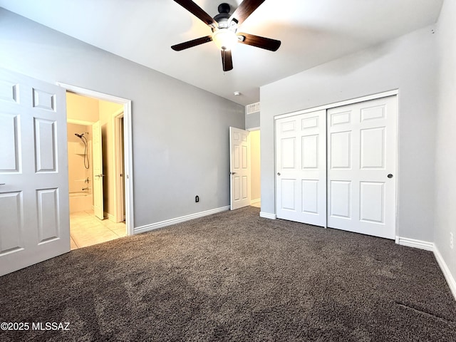 9636 N Havenwood Way, Marana, AZ 85653 - unfurnished bedroom with carpet, a closet, and ceiling fan