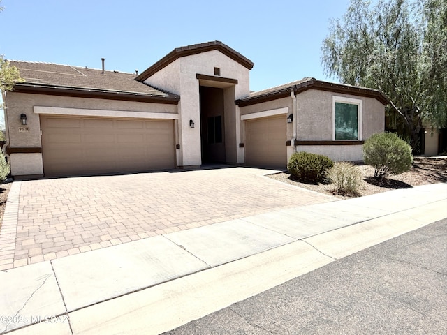 9636 N Havenwood Way, Marana, AZ 85653 - ranch-style house with an attached garage, decorative driveway, and stucco siding
