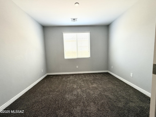 9636 N Havenwood Way, Marana, AZ 85653 - unfurnished room with dark colored carpet and baseboards