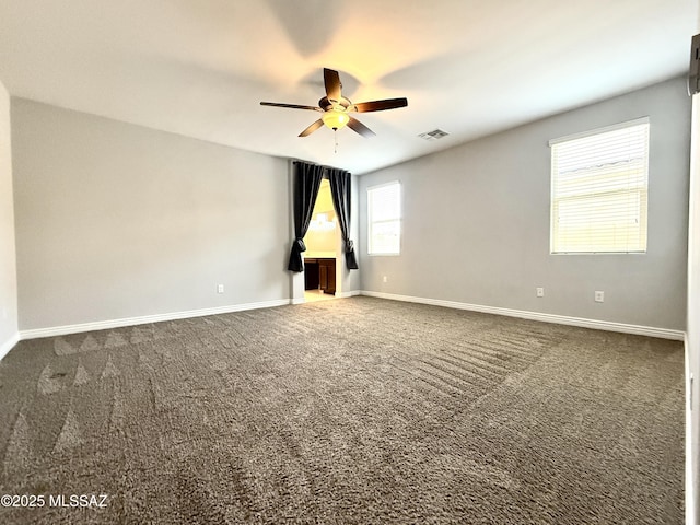 9636 N Havenwood Way, Marana, AZ 85653 - unfurnished room with ceiling fan and dark colored carpet