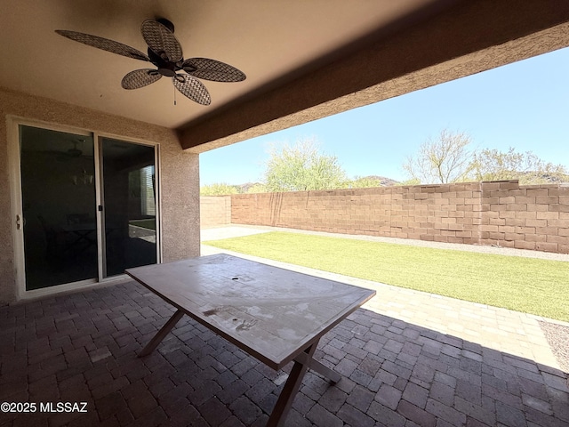 9636 N Havenwood Way, Marana, AZ 85653 - fenced backyard with a ceiling fan and a patio area