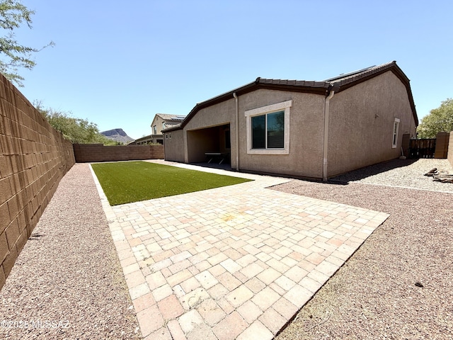 9636 N Havenwood Way, Marana, AZ 85653 - back of house with a fenced backyard, stucco siding, and a patio area