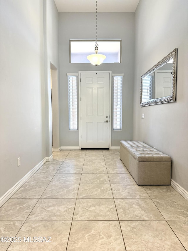 9636 N Havenwood Way, Marana, AZ 85653 - entrance foyer with a towering ceiling, plenty of natural light, and light tile patterned floors