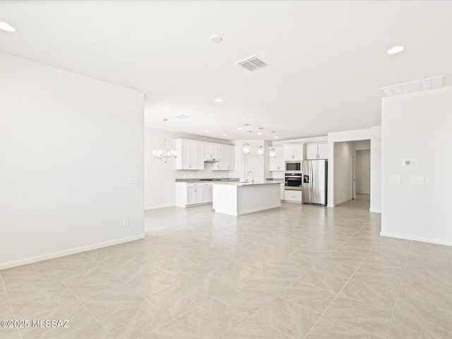 306 N Spring Flower Dr, Tucson, AZ 85748 - unfurnished living room with recessed lighting and a chandelier