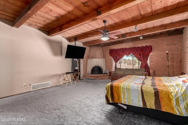 10901 N Camino De Oeste, Tucson, AZ 85742 - bedroom with a wood ceiling with exposed beams, carpet floors, a brick fireplace, and brick wall