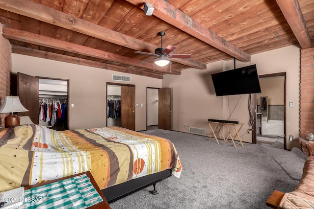 10901 N Camino De Oeste, Tucson, AZ 85742 - carpeted bedroom featuring a wooden ceiling with exposed beams and multiple closets