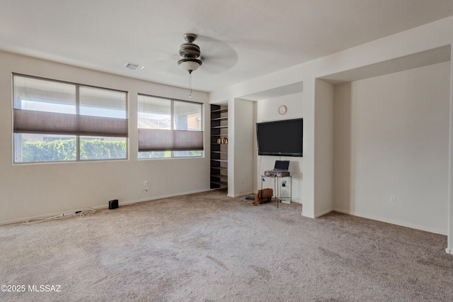 817 E Deer Spring Canyon Pl, Sahuarita, AZ 85629 - unfurnished living room featuring a ceiling fan and carpet flooring