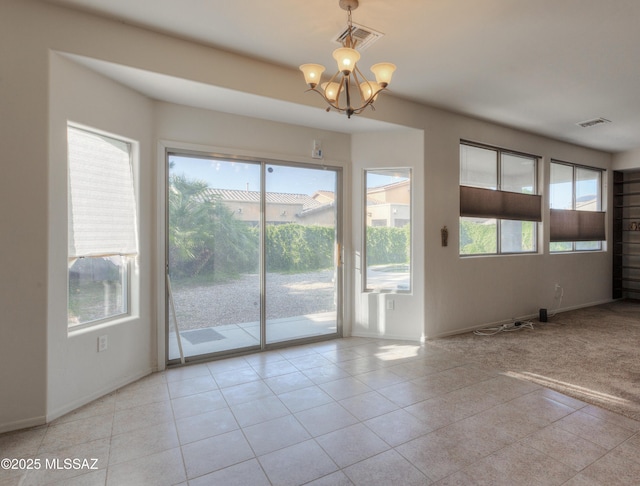 817 E Deer Spring Canyon Pl, Sahuarita, AZ 85629 - spare room with a chandelier and light tile patterned flooring
