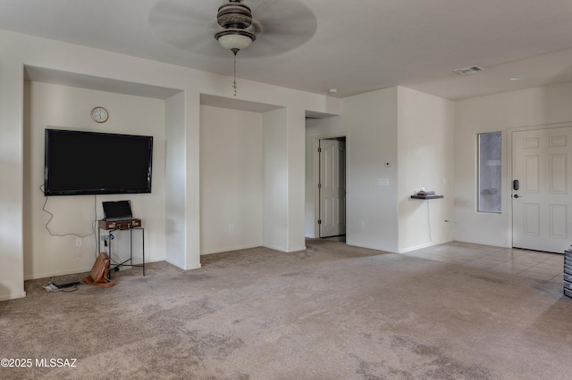 817 E Deer Spring Canyon Pl, Sahuarita, AZ 85629 - unfurnished living room featuring carpet flooring and ceiling fan