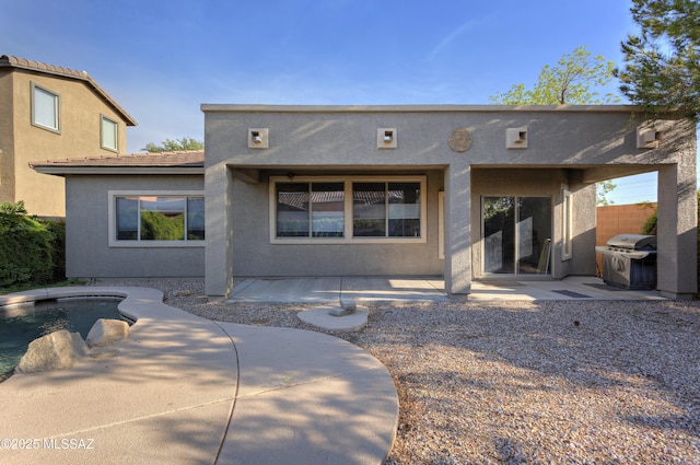 817 E Deer Spring Canyon Pl, Sahuarita, AZ 85629 - back of property with a patio and stucco siding