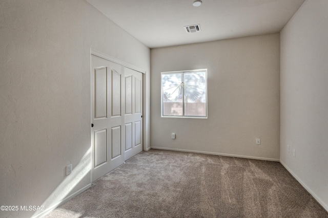 817 E Deer Spring Canyon Pl, Sahuarita, AZ 85629 - unfurnished bedroom featuring carpet floors and a closet