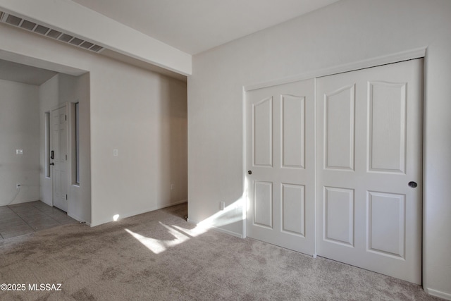817 E Deer Spring Canyon Pl, Sahuarita, AZ 85629 - unfurnished bedroom featuring carpet and a closet