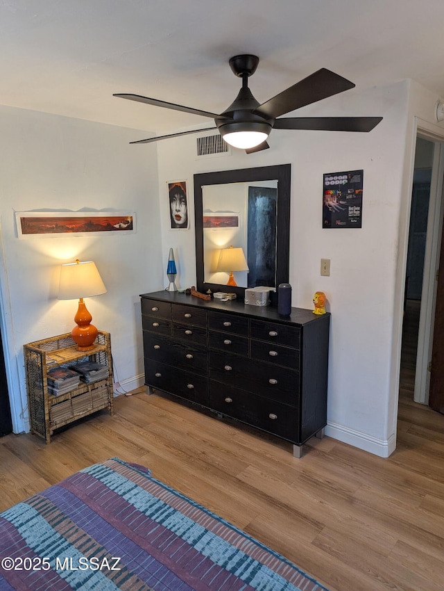1036 S 4th Ave, Tucson, AZ 85701 - bedroom with wood finished floors and a ceiling fan