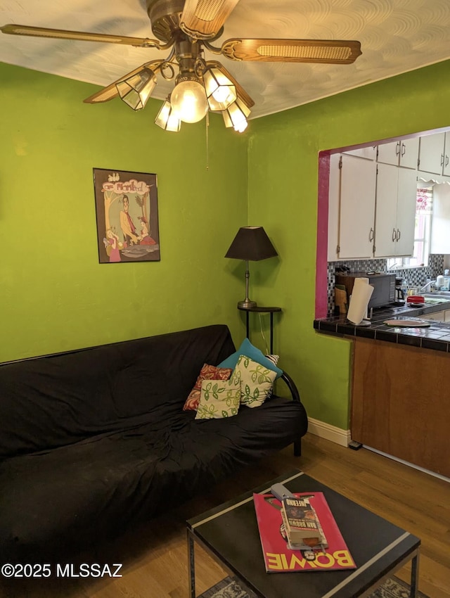 1036 S 4th Ave, Tucson, AZ 85701 - living area with wood finished floors and ceiling fan