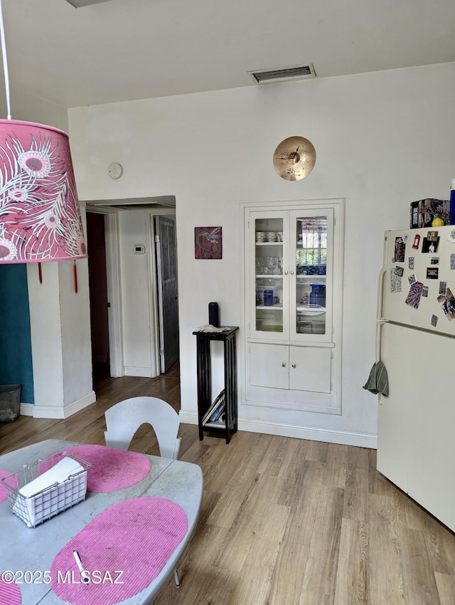 1036 S 4th Ave, Tucson, AZ 85701 - dining space with wood finished floors and baseboards