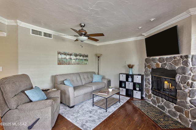 6651 N Campbell Ave Unit 286, Tucson, AZ 85718 - living room featuring wood finished floors, a fireplace, a ceiling fan, and crown molding