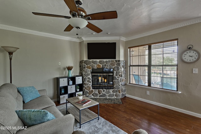 6651 N Campbell Ave Unit 286, Tucson, AZ 85718 - living area with a stone fireplace, wood finished floors, ceiling fan, and ornamental molding