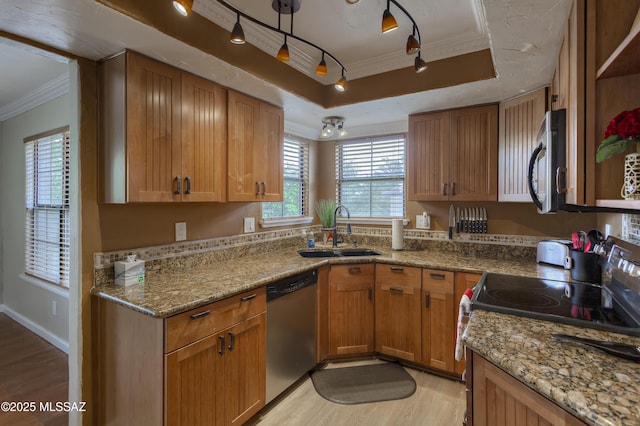 6651 N Campbell Ave Unit 286, Tucson, AZ 85718 - kitchen featuring stainless steel appliances, ornamental molding, light wood-style flooring, a raised ceiling, and light stone counters