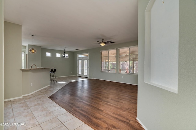 9223 N Crimson Stone Pl, Tucson, AZ 85743 - unfurnished living room featuring light tile patterned flooring and ceiling fan