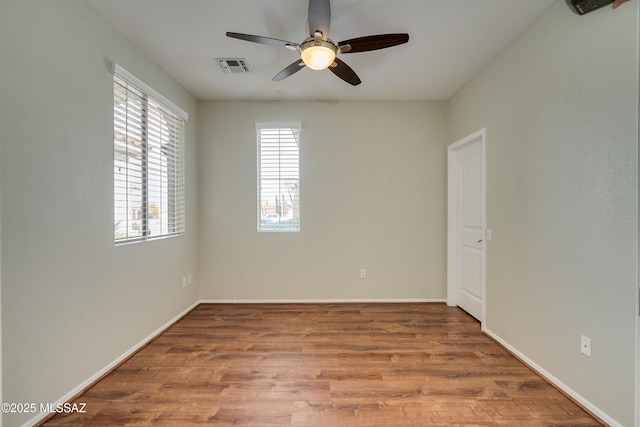 9223 N Crimson Stone Pl, Tucson, AZ 85743 - unfurnished room with a ceiling fan and wood finished floors
