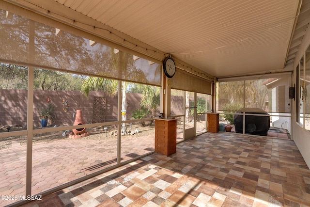 9223 N Crimson Stone Pl, Tucson, AZ 85743 - unfurnished sunroom featuring plenty of natural light