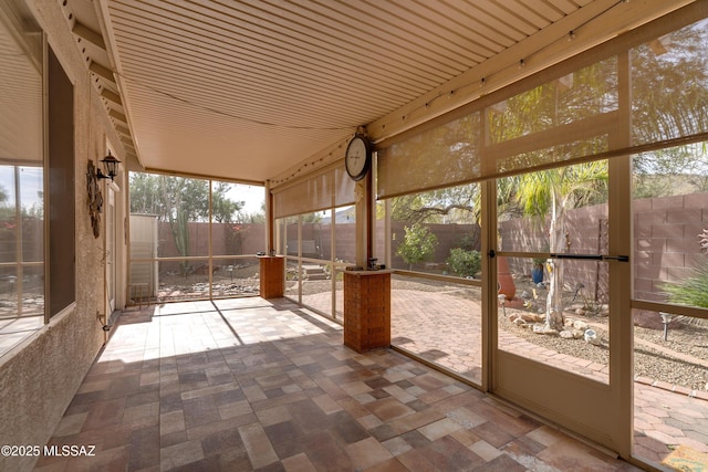 9223 N Crimson Stone Pl, Tucson, AZ 85743 - unfurnished sunroom featuring healthy amount of natural light