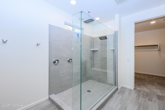 6860 E Via Arroyo Largo, Tucson, AZ 85756 - full bath with a walk in shower, a walk in closet, recessed lighting, and wood finished floors