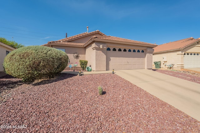9908 E Shadow Glen Ct, Tucson, AZ 85748 - view of front of home featuring stucco siding, an attached garage, a tiled roof, and driveway