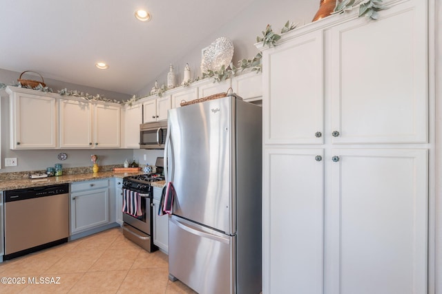9908 E Shadow Glen Ct, Tucson, AZ 85748 - kitchen featuring stainless steel appliances, recessed lighting, light tile patterned floors, white cabinets, and light stone countertops