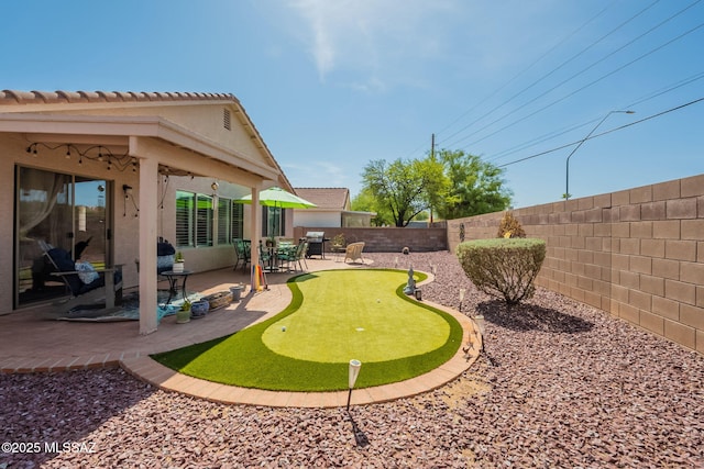 9908 E Shadow Glen Ct, Tucson, AZ 85748 - fenced backyard with a putting area and a patio area