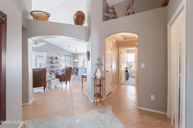 9908 E Shadow Glen Ct, Tucson, AZ 85748 - hallway featuring arched walkways, light tile patterned floors, and lofted ceiling