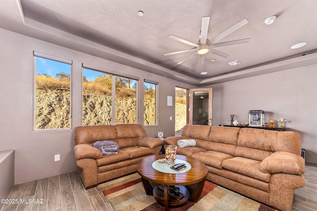 3188 W Tumamoc Dr, Tucson, AZ 85745 - living room featuring a raised ceiling, wood tiled floors, and ceiling fan