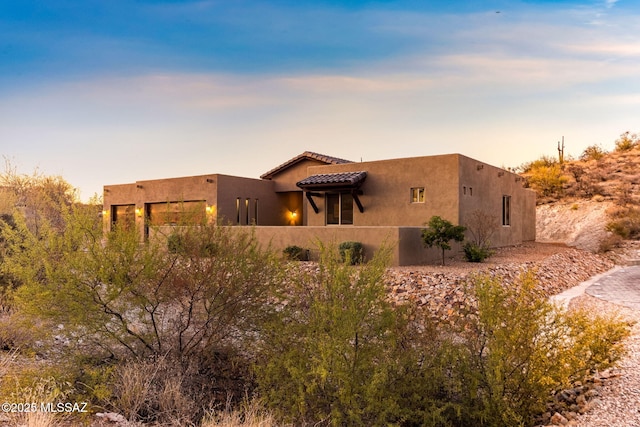 3188 W Tumamoc Dr, Tucson, AZ 85745 - view of front of house with stucco siding and a tiled roof