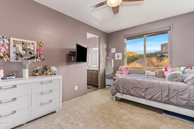 3188 W Tumamoc Dr, Tucson, AZ 85745 - bedroom with light colored carpet, connected bathroom, and a ceiling fan