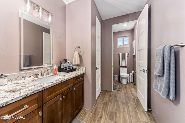 3188 W Tumamoc Dr, Tucson, AZ 85745 - bathroom featuring wood tiled floors and vanity