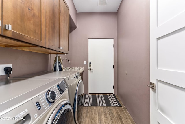 3188 W Tumamoc Dr, Tucson, AZ 85745 - laundry area featuring cabinet space, washer and dryer, and wood finished floors