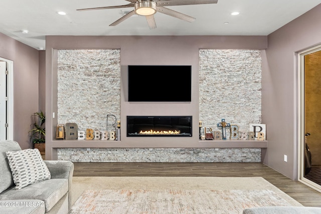 3188 W Tumamoc Dr, Tucson, AZ 85745 - living area featuring wood finished floors, a glass covered fireplace, ceiling fan, and recessed lighting