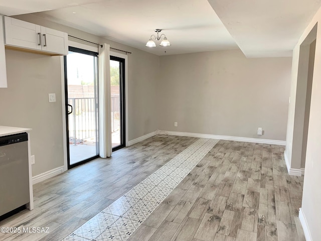 2973 S Kolb Rd, Tucson, AZ 85730 - unfurnished dining area with light wood finished floors and a chandelier