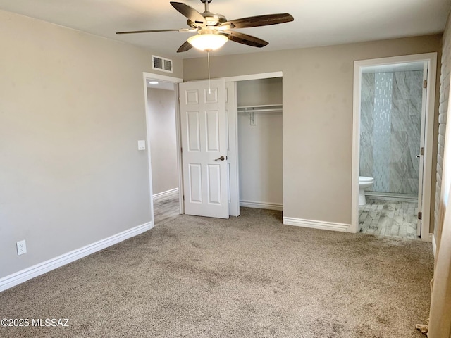 2973 S Kolb Rd, Tucson, AZ 85730 - unfurnished bedroom with carpet flooring, a closet, connected bathroom, and ceiling fan