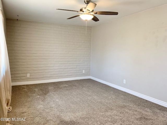 2973 S Kolb Rd, Tucson, AZ 85730 - carpeted empty room featuring a ceiling fan and brick wall