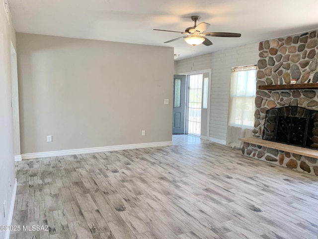 2973 S Kolb Rd, Tucson, AZ 85730 - unfurnished living room featuring wood finished floors, ceiling fan, and a fireplace