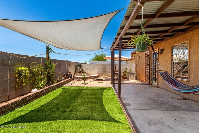 5482 S Monrovia Ave, Tucson, AZ 85706 - fenced backyard with a patio area